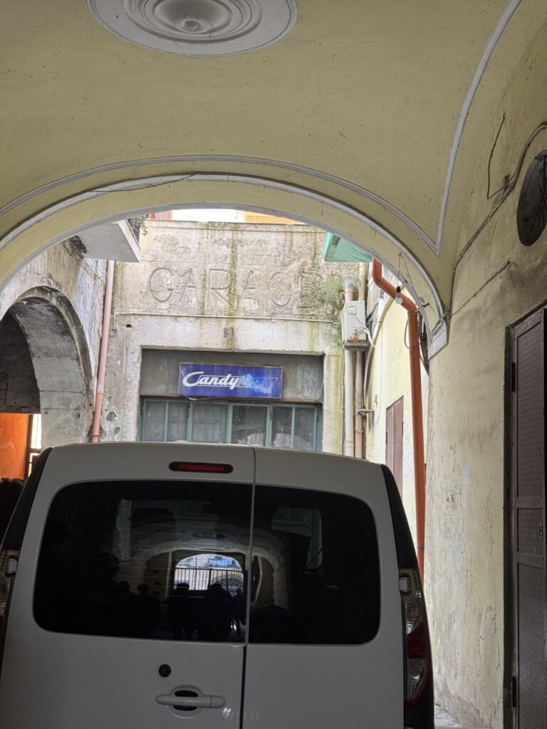 the garage: The foyer of the apartment complex where Radio Sinai is showcasing a garage entrance